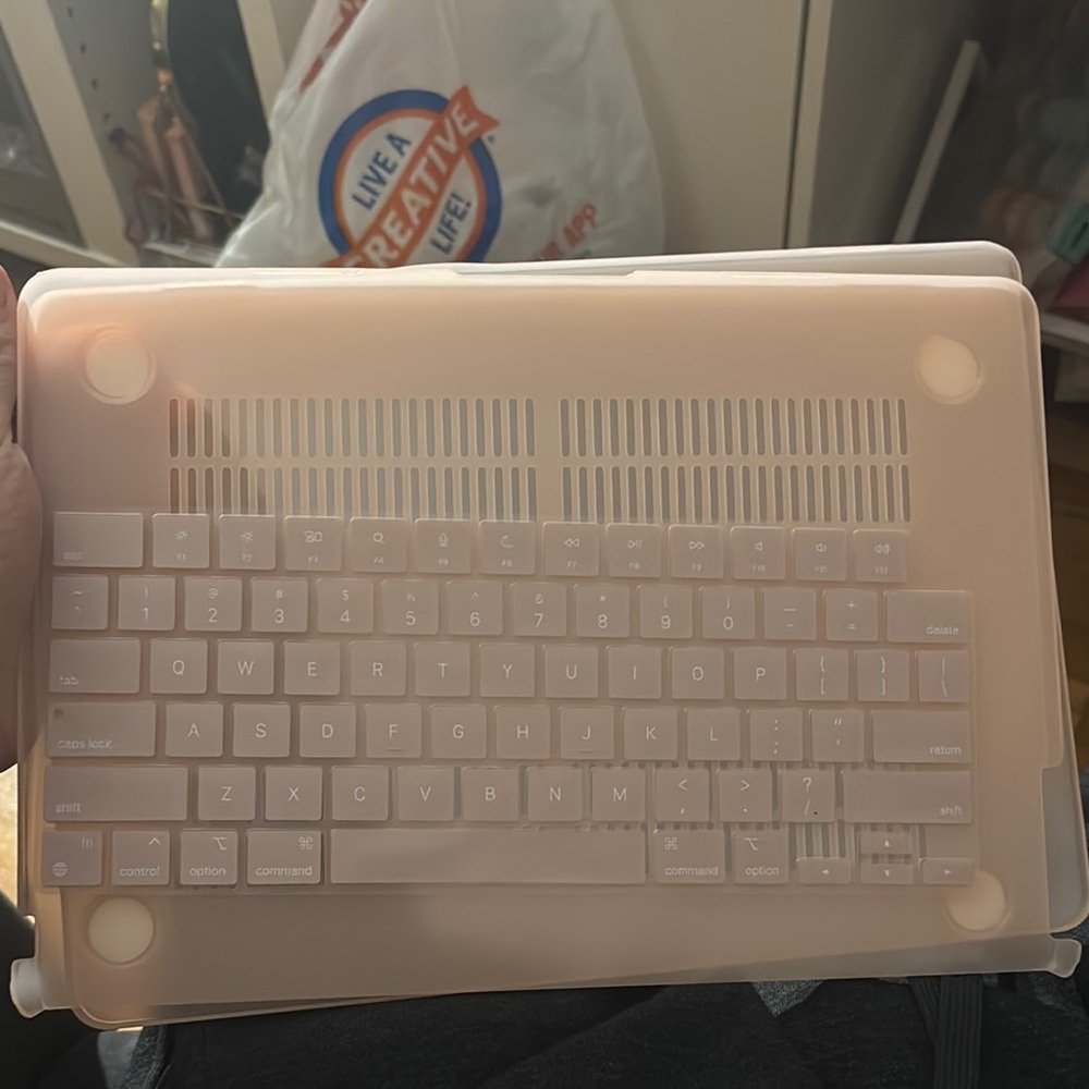 Apple Laptop with Pink Cover